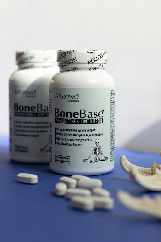 Two bottles of bonebasee sit next to a broken bone
